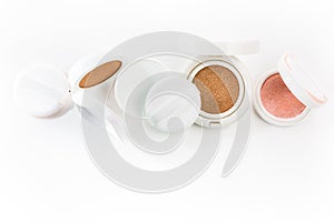 Refills of foundation and highlighter cushion on a white background