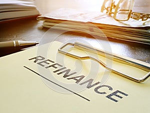 Refinance concept. Stack of business documents on table