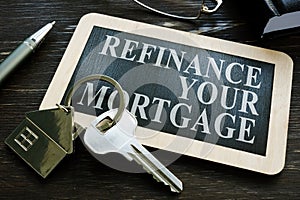 Refinance your mortgage word on the small blackboard.