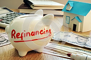 Refinancing written on a piggy bank. photo