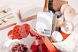 Refined Christmas gift basket for culinary enthusiats with bottle of oil, vinegar and kitchen utensils