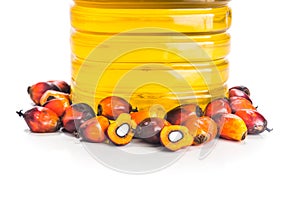 Refined palm oil in bottle with fresh oil palm fruits. photo