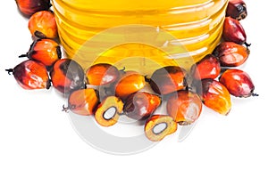 Refined palm oil in bottle with fresh oil palm fruits.