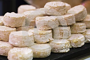 Refined Pelardon goat cheese in display