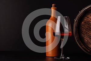 A refined selection of aged cheeses presented on a board, accompanied by a glass of wine