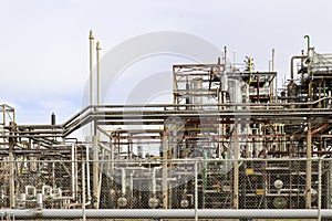 Refinery installation and tanks in the Botlek harbor at the port of Rotterdam