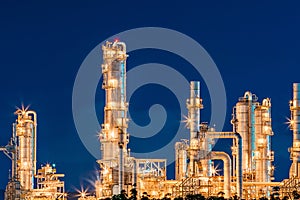 Refinery oil and gas industry at night blue sky after sunset time with chemical and petroleum for energy of transportation and