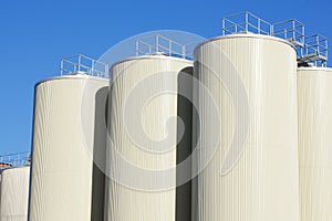 Refinery oil storage tanks and blue sky