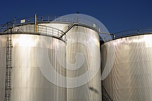 Refinery oil tanks in sunlight