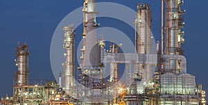 Refinery plant exterior structure against dusky blue sky