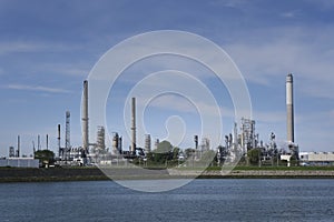 Refinery tower in petrochemical industrial plant with cloudy sky, Refinery factory oil storage tank and pipeline steel