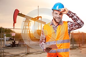 Refinery worker with digital tablet