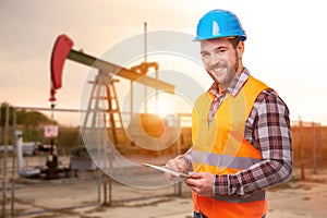 Refinery worker with digital tablet