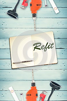 Refit against tools and notepad on wooden background photo