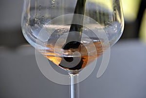 Reflecion of a straw in a cocktail glass