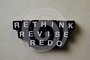 Reflect - Rethink - Redo on wooden blocks. Business and inspiration concept photo