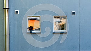 Reflected abstract objects in the window glasses of a house