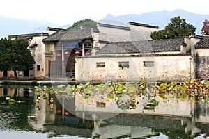Reflecting buildings in water village Hongcun (Unesco), China