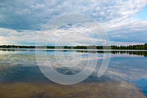 Reflecting lake in rural Lithuania