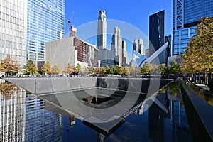 Reflecting pool and surrounding buildings at National September 11 Memorial.