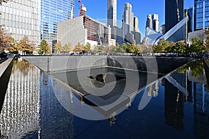 Reflecting pool and surrounding buildings at National September 11 Memorial