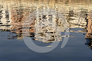 Reflection architecture city Udaipur in water lake at sunset. India, Rajasthan