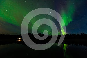 Reflection of Aurora Borealis over Olnes pond in Fairbanks, Alaska