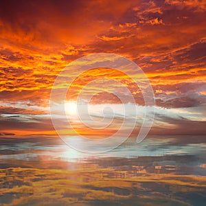 Reflection of Beautiful Sunset / Majestic Clouds and Sun above photo
