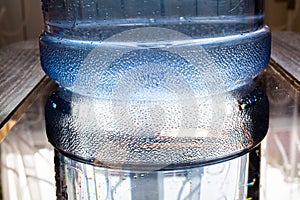 Reflection of bottom of big water bottle.