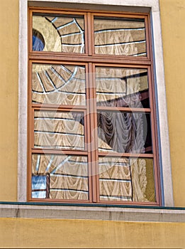 Reflection of a building decor in a window