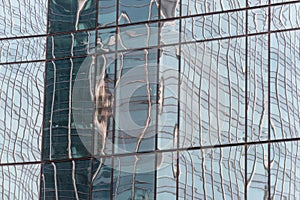The reflection of a building in the glass window of a building photo