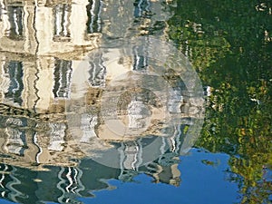 Reflection of building and trees in water