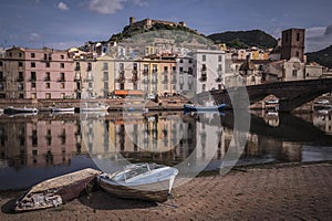 Reflection of the buildings in thee river captured in Basa, Sardinia photo