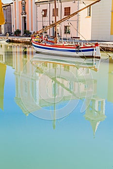 Reflection of church and boats on Canal Port