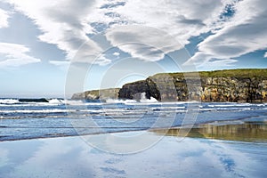 Reflection of cliffs and clouds