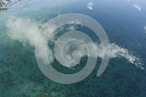 The relelction of a cloud in the water