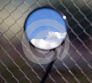 Reflection of clouds on a blue sky in a motobike mirror