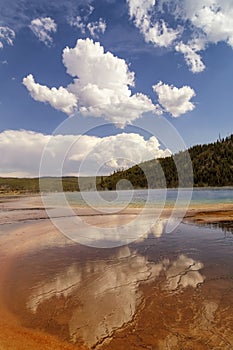 Reflection of clouds in Grand Prismatic spring in the Midway Geyser Basin in Yellowstone National Park