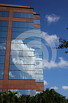Reflection of clouds on modern office building