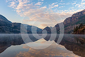 Reflection of clouds and mountains on Benson Lake, Yosemite National Park