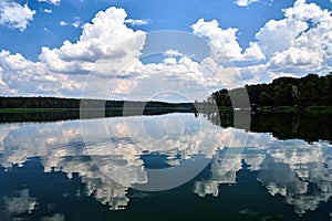 Reflection of clouds in the waters of Lake Chycina during summe