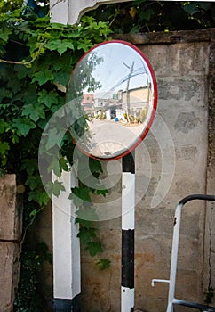 Reflection in concave lens mirror. Street or Traffic Concave Mirror.