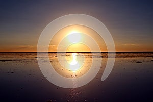 Reflection of the Famous Mirror effect at Sunset on Uyuni Salt Flats or Salar de Uyuni in Bolivia, South America