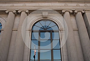 Reflection of flags at the Pennington County Courthouse in Rapid City South Dakota