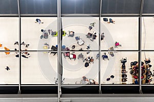 Reflection glass of top view people in line queue with luggage and briefcase to travel at airport