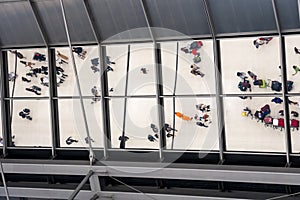 Reflection glass of top view people in line queue with luggage and briefcase to travel at airport