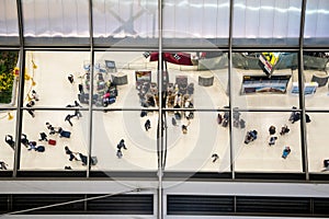 Reflection glass of top view people in line queue with luggage and briefcase to travel at airport