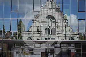 Reflection of a Historic Building in a Modern Glass Facade in Aachen, Germany