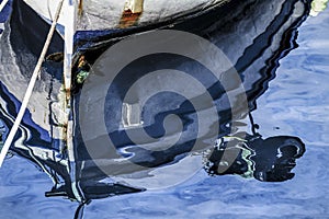 Reflection of the hull of the boat