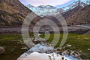 Reflection of Jebel Toubkal in the water during sunset